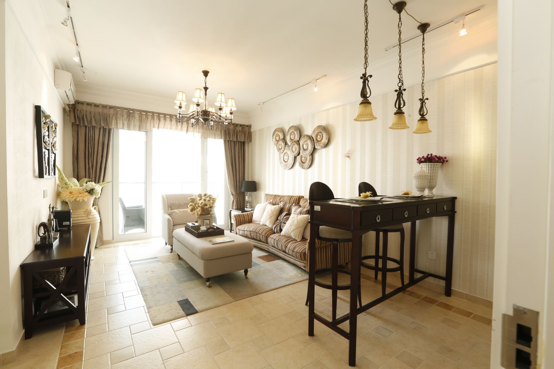 Contemporary living room with modern furniture and elegant lighting.