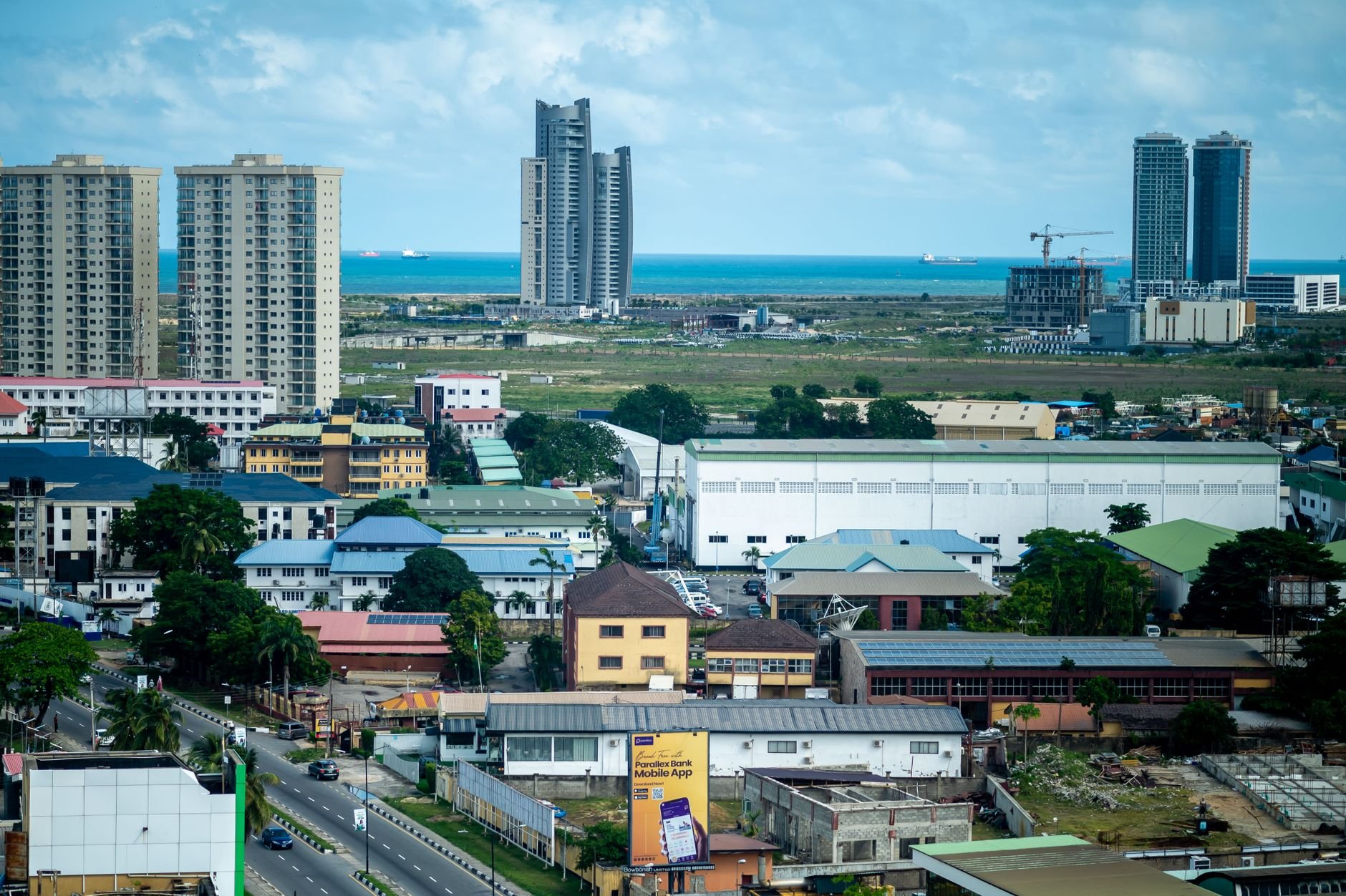 Modern cityscape of Lagos, Nigeria, with residential and commercial buildings near the ocean.